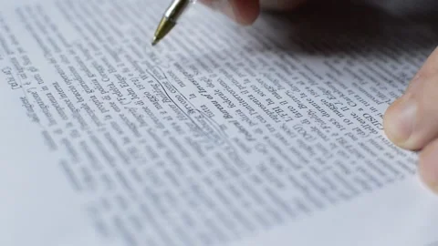 Close-up businessman using pen for working on document in the office. Video stock 217380225