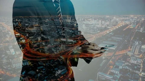 Close up to businessman is using a smartphone and double exposure cityscape. Stock Footage 81069173