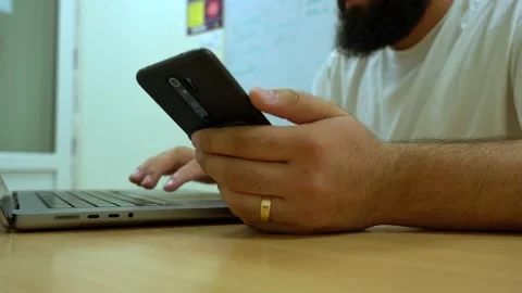Close Up of Businessman Using Smartphone at Office Desk Vídeo Stock 341767005