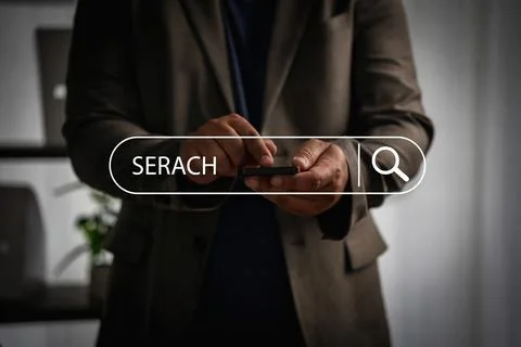 Close-up of businessman using smartphone with virtual search bar, symbolizi.. Stock Photos
