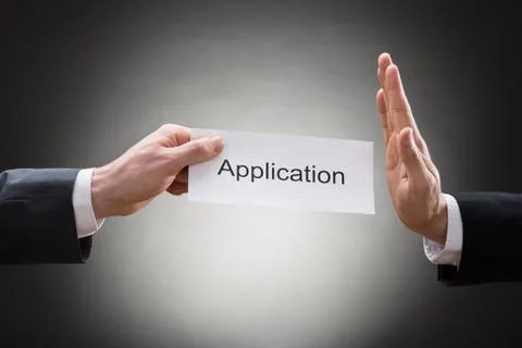 Close-up Of A Businessman's Hand Avoiding Application Form Stock Photos