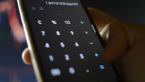 Close-up businessman's hand using phone calculator for economy work Video stock 197956615