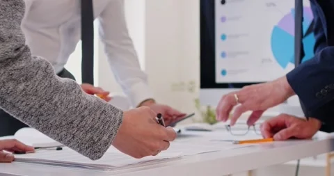 Close up of businesspeople hands working on data project, startup presentation Stock Footage 320434606