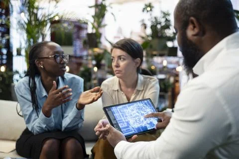 Close up of businesspeople using neural network AI interface on tablet Foto stock