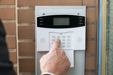 Close-up Of Businessperson Hand Entering Code In Security System Foto stock