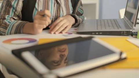 Close-up of a businesswoman developing project  on a digital tablet computer Video stock 74735779