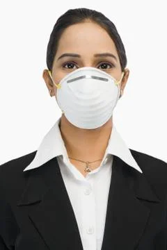 Close-up of a businesswoman wearing an H1N1 mask Stock Photos