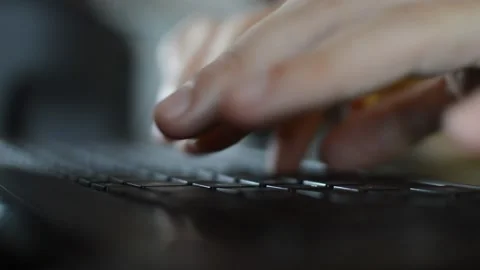 Close-up busy man's hand typing on a black laptop Vidéo 200489545