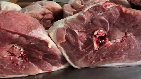 Close-up of a butcher cutting lamb ribs  in a shop Stock Footage 308239223