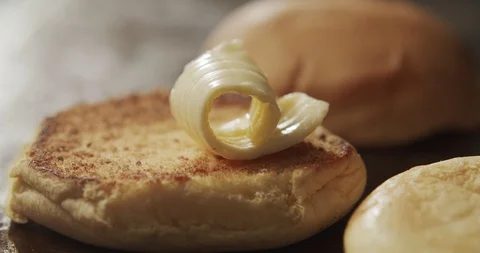 Close-up of butter melts on burger bun. Slow motion video Stock Footage 116244931