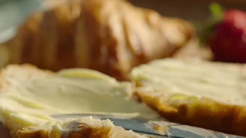 Close up buttering croissant fresh baked Stock Footage 196707885