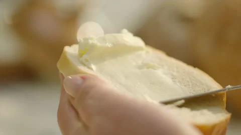 Close up buttering fresh bread 스톡 동영상 189834982