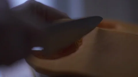 Close up butternut squash being sliced Stock Footage 127129665