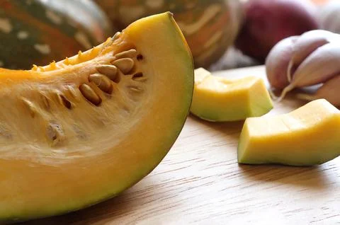 Close up of Butternut squash, pumpkin squash with spices for cooking on wooden  Stock Photos