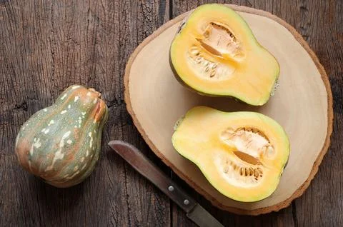 Close up of Butternut squash, pumpkin squash with spices for cooking on wooden Stock Photos