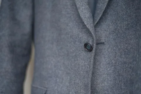 Close-up of a button on a blue business jacket Photos