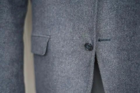 Close-up of a button on a blue business jacket Foto stock