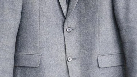 Close-up of a button on a blue business jacket Photos