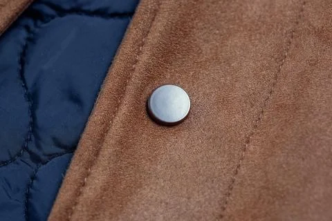 Close-up of a button-down button on a faux suede jacket Foto stock