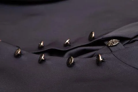 Close-up of buttoned suit jacket featuring intricate design 스톡 사진