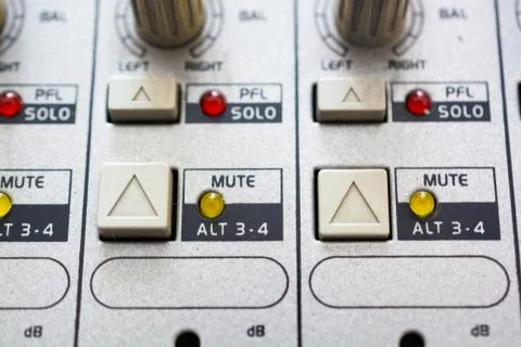 Close Up Buttons and Knobs On Audio Mixer. Buttons and Lamps. Foto stock