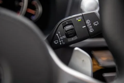 A close-up of the buttons of the multi-function turn signal lever with the wi Stock Photos