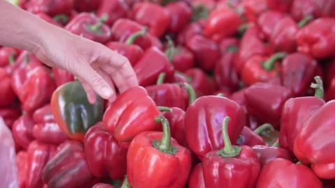 Close-up, the buyer puts large sweets in the bag Video stock 241088882