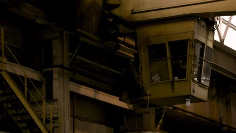 Close Up of Cabin of crane in Steel Mill factory - Moves towards Camera Stock Footage 89944528