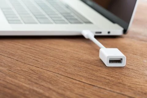 Close-up cable data convert to laptop computer new modern technology transf.. Stock Photos