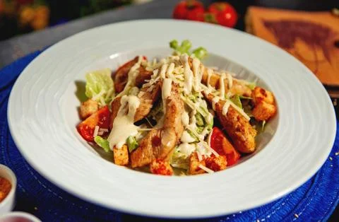 Close up of caesar salad in white plate Stock Photos