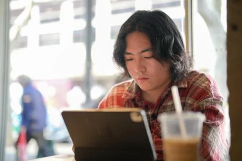 Close cafe view of person using tablet Stock Photos