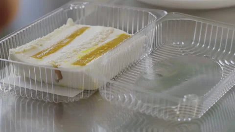 Close-up, Cake Piece Lies in Plastic Box on The Table Stock Footage 139936493
