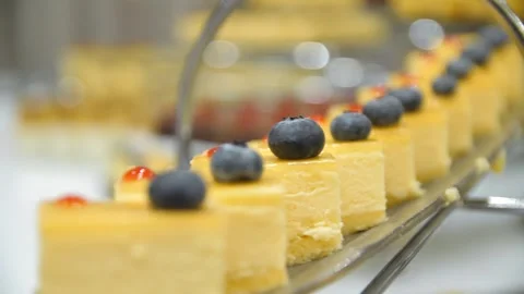 Close-up of cakes with blueberries on a buffet table in a restaurant. Stock Footage 269932815