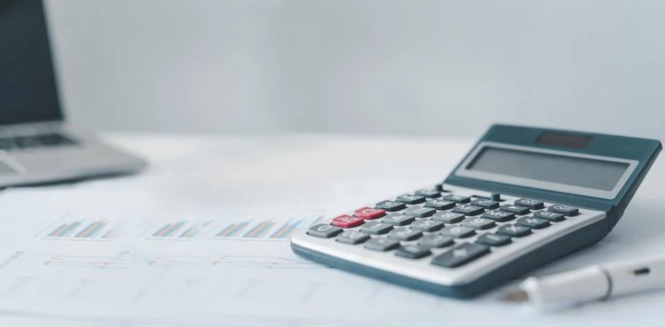Close-up calculator on graph documents, device for calculating the numbers. Stock Photos