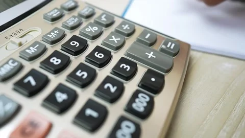 Close-up of a calculator with large buttons on a desk Stock Footage 317736865