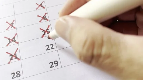 Close-up of a calendar marked with a red marker Stock Footage 328571758