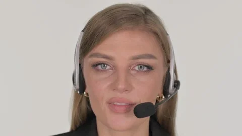 Close up of Call Center Employee with Headset Talking on White Background Stock Footage 295901606