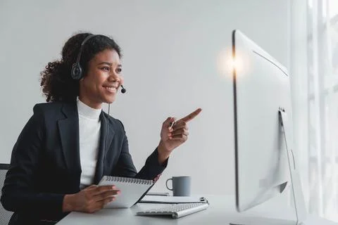 Close up call center operator in wireless headset talking with customer, woman Stock Photos