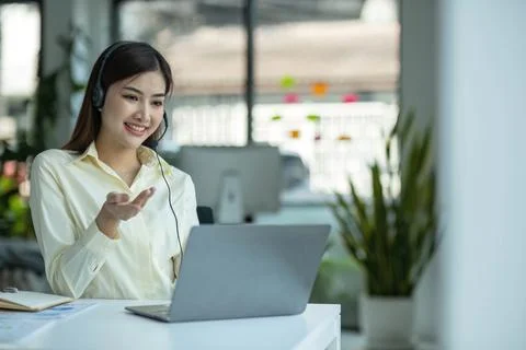 Close up call center operator in wireless headset talking with customer, woman Stock Photos