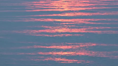 Close up calm ocean waves on sunset Stock Footage 258854437