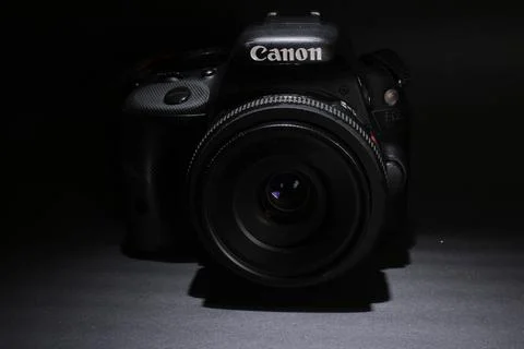 A Close Up Of Camera Against dark Background Stock Photos