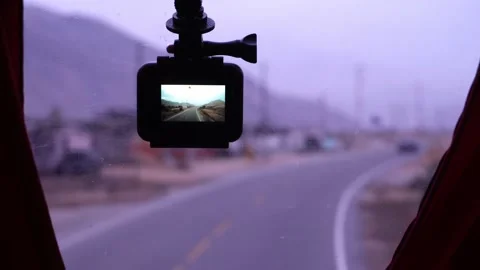 Close-up of a camera attached to the windshield of a travel bus in the front Видео 164430455