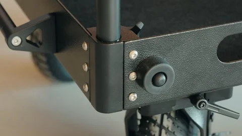 Close Up of Camera Cart Corner with Wheels, Bolts and Rubber Foot Stock Footage 342683209