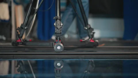 Close-up Camera Dolly Wheel Rolling on Track in Professional Studio with Stock Footage 317590241
