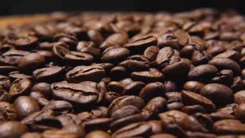 Close-up of the camera flying around roasted brown coffee beans. Parallax effect Stock-Footage 230617340