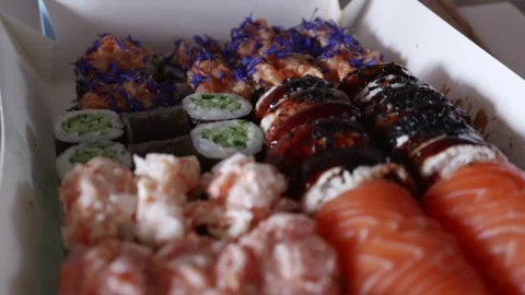 Close camera glide movement over delicious sushi roll set on restaurant table Stock Footage 344877073
