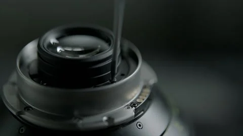 Close up camera lens and unscrewing the bolt of filter on it in rental house Stock Footage 134938383