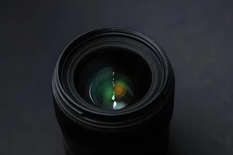 Close-up of camera lens on dark background Stock Photos