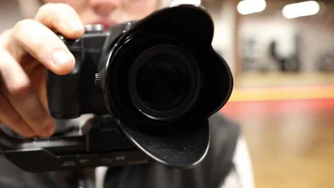 Close up camera lens filming Stock Footage 332902364