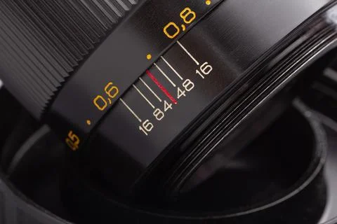 Close-up of a camera lens with precise focus markings Stock Photos